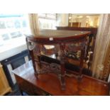 A carved Mahogany console table