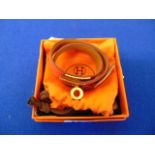 A Hermes Kelly double Orange leather gold plated wrap bracelet,