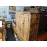 A Pine Gothic style cabinet with one interior drawer, a.