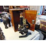 A Charles Perry black lacquered microscope with lenses (4)