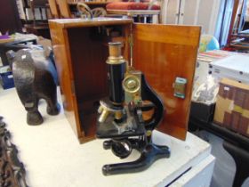 A Charles Perry black lacquered microscope with lenses (4)