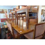 A Mid-century Scandinavian Teak extending dining table and eight chairs ( six chairs and two