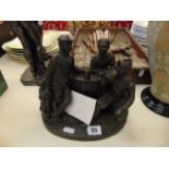 A bronze resin figural group,
