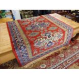 An eastern red ground rug, approx.