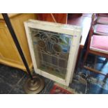 A pair of Art Nouveau stained glass window panels,