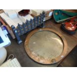 An Arts and crafts circular Copper frame and a Iron fire grate front