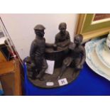 A bronze resin figural group,