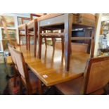 A Mid-century Scandinavian Teak extending dining table and eight chairs ( six chairs and two