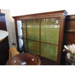 A wall hanging display cabinet