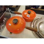 Two Le Creuset saucepans