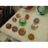 A collection of paperweights