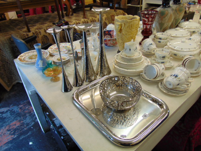 A qty of candlesticks and Alessi bowl and tray