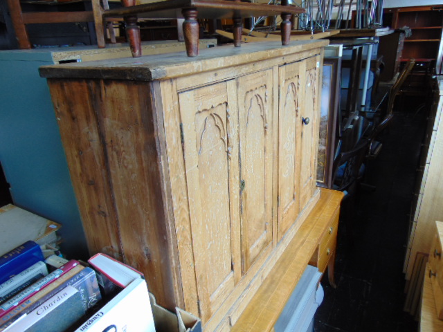 A Pine Gothic style cabinet with one interior drawer, a.