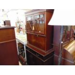 A Mahogany bookcase on cupboard base