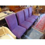 Four purple upholstered dining chairs