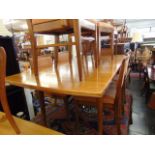 A Mid-century Scandinavian Teak extending dining table and eight chairs ( six chairs and two