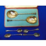 A boxed silver pair of serving spoons plus another box of four spoons (should be 6,