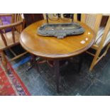 A circular Mahogany occasional table