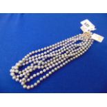 Four Grey pearl necklaces,