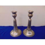 A pair of continental candlesticks marked 900