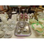 A qty of candlesticks and Alessi bowl and tray