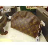 A Louis Vuitton clutch/ vanity bag