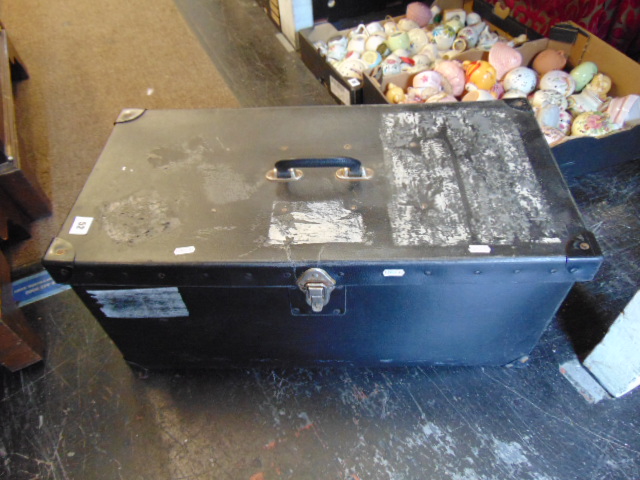 A small black storage trunk