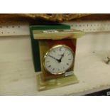 An Onyx mantle clock, batter, working order, by Azizoff of London,