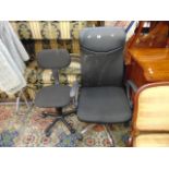 Two black office swivel chairs