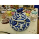 A blue and white oriental lidded jar/ urn