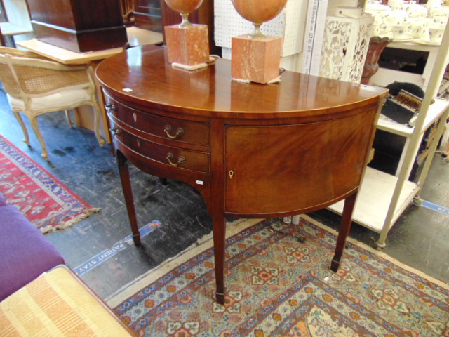 A Georgian demi lune two drawer console