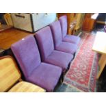 Four purple upholstered dining chairs