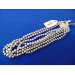 Four Grey pearl necklaces,