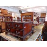 A wooden coffee table with small cabinet