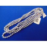 Four Grey pearl necklaces,