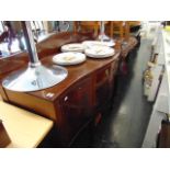 A Mahogany serpentine sideboard