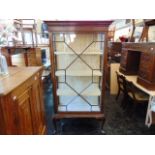 An Edwardian single door display cabinet