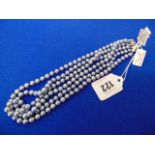 Three Grey pearl necklaces,