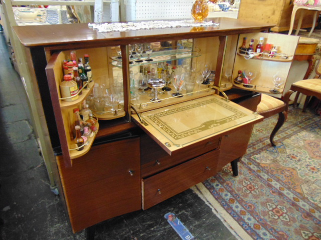 A mid-century cocktail cabinet inc.