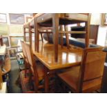 A Mid-century Scandinavian Teak extending dining table and eight chairs ( six chairs and two