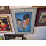 A framed picture of a clown,