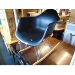 An Aram design style rocking chair
