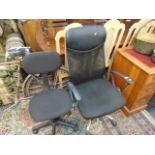 Two black office swivel chairs
