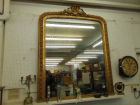 An antique gilt over mantle mirror,