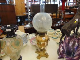 A Victorian hand painted Ormulu oil lamp,
