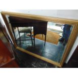 A large gilt rectangular wall mirror