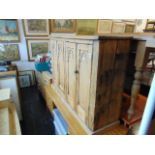 A Pine Gothic style cabinet with one interior drawer, a.