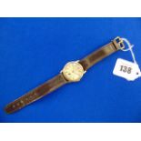 A 9ct gold Longines watch with leather strap