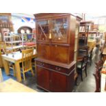 A Mahogany bookcase on cupboard base