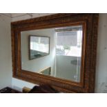 A rectangular decorative wall mirror